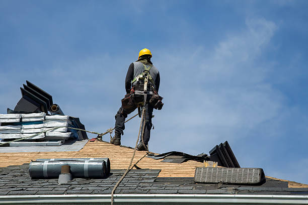 Professional Gutter Installation technician working in Longmire, WA